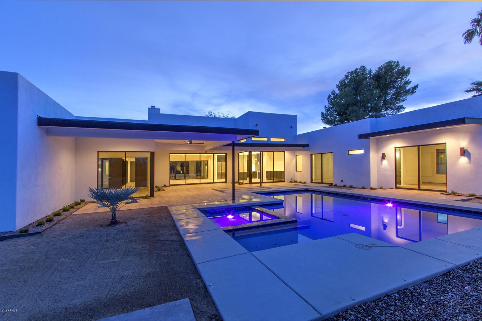 Contemporary salt water pool and hot tub. Situated just steps off of the 800 sf of covered patio space.