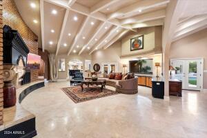 Family room with vaulted and wood beam ceilings
