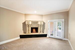 Primary suite sitting room with gas fireplace