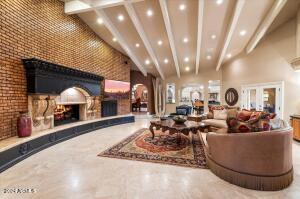 Family room with custom gas fireplace and accent brick wall