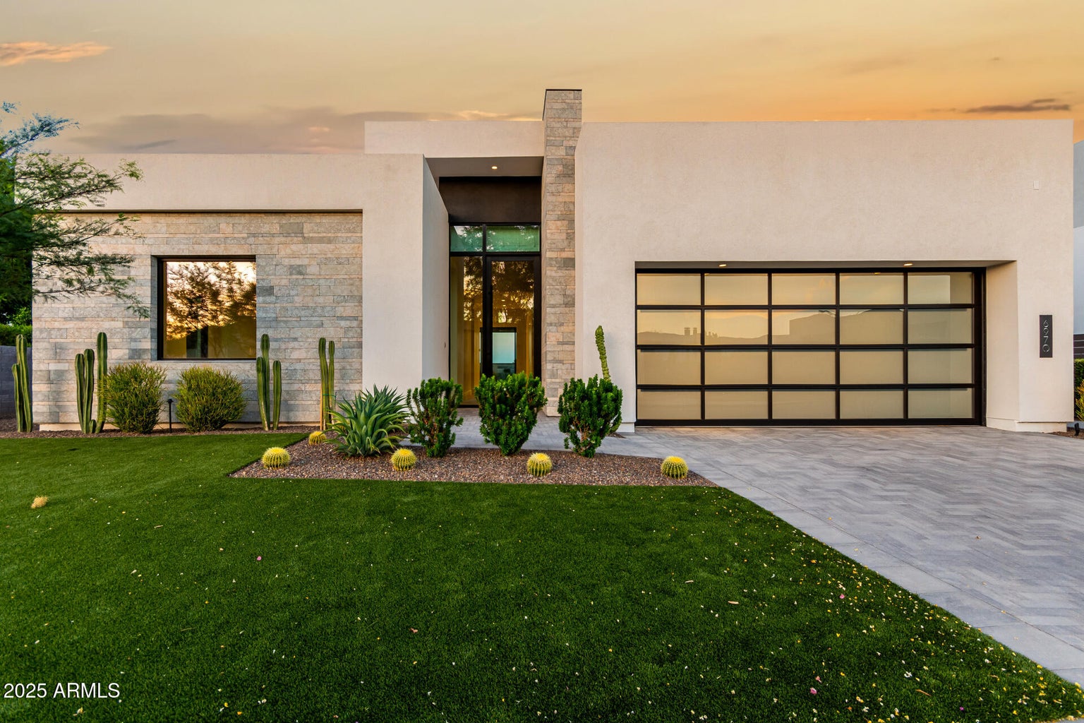 Front of home with paved driveway